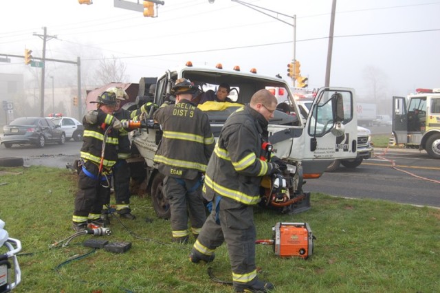 District 9 and 11 crews work to extricate the passenger  in an MVA at Route 1 North and Green Street on April 10, 2008.